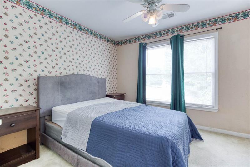 1008 Post Horn Run Lawrenceville, GA 30045 - Photo 26 of 64 a bedroom with a bed and a window