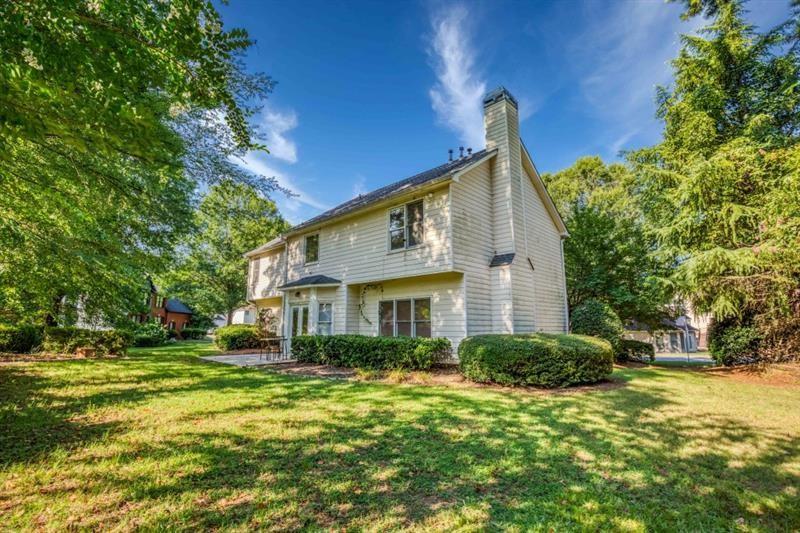 1008 Post Horn Run Lawrenceville, GA 30045 - Photo 29 of 64 a front view of a house with a garden