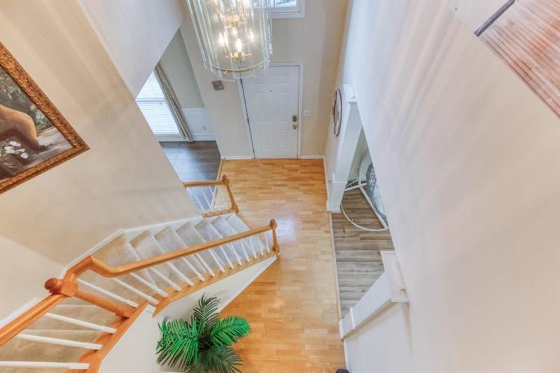 1008 Post Horn Run Lawrenceville, GA 30045 - Photo 3 of 64 a view of entryway and hall with wooden floor