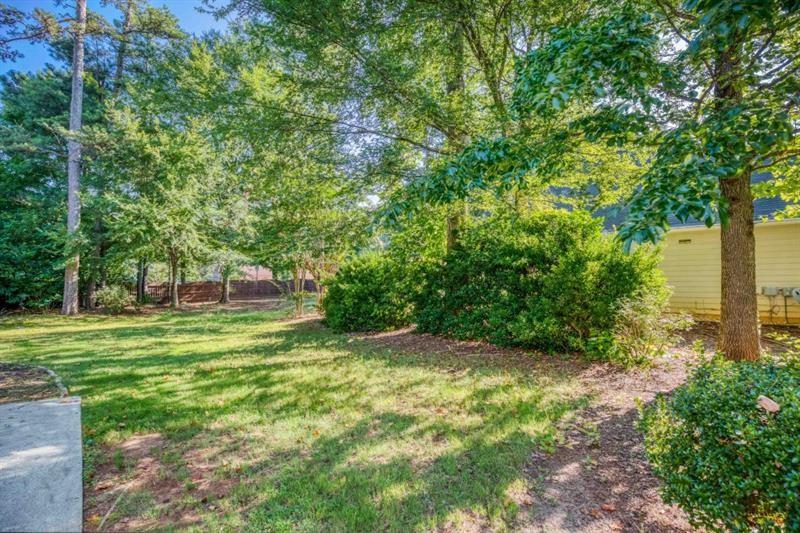 1008 Post Horn Run Lawrenceville, GA 30045 - Photo 32 of 64 a view of a big yard with large trees