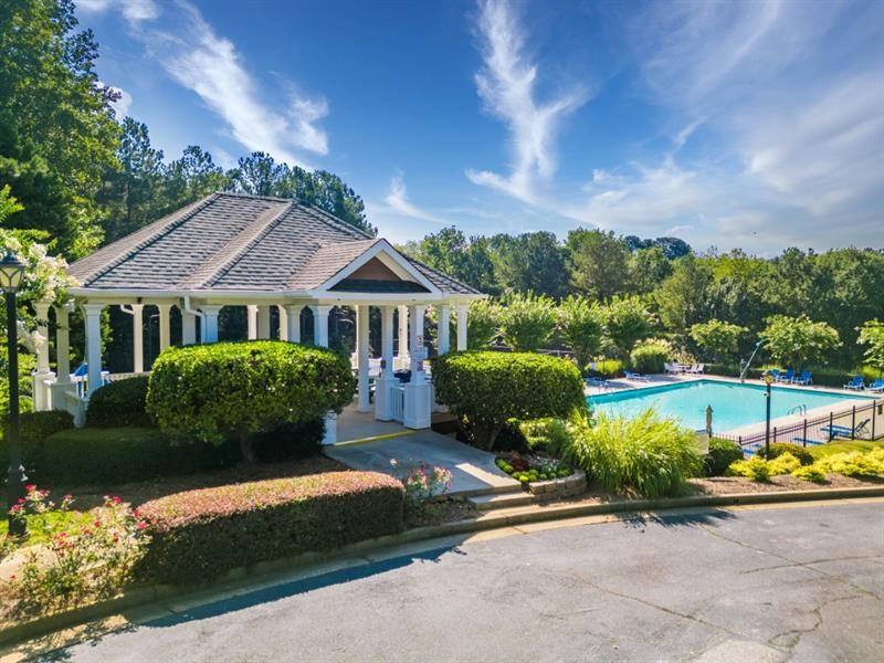 1008 Post Horn Run Lawrenceville, GA 30045 - Photo 33 of 64 a front view of a house with a garden and pathway