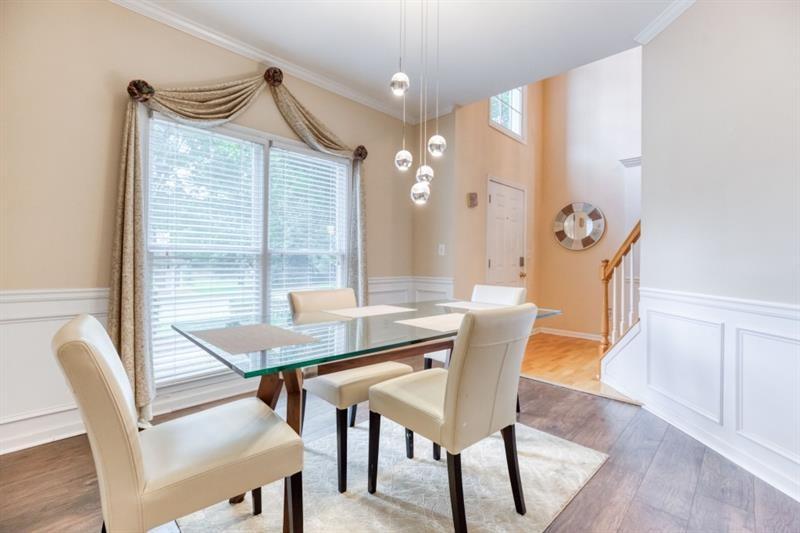 1008 Post Horn Run Lawrenceville, GA 30045 - Photo 4 of 64 a view of a dining room with furniture and wooden floor