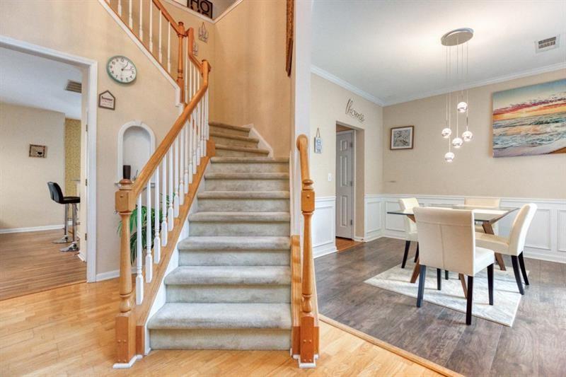1008 Post Horn Run Lawrenceville, GA 30045 - Photo 45 of 64 a view of a dining room with furniture entryway and wooden floor