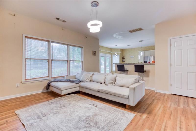 1008 Post Horn Run Lawrenceville, GA 30045 - Photo 47 of 64 a living room with furniture and a large window