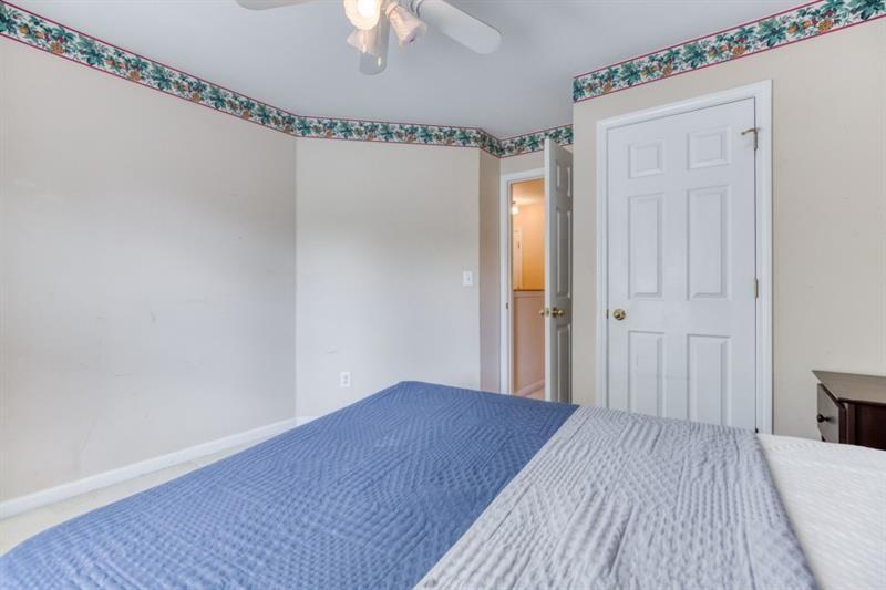 1008 Post Horn Run Lawrenceville, GA 30045 - Photo 52 of 64 a view of a room with wooden floor and staircase