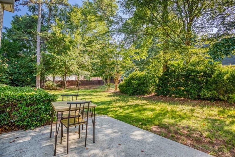 1008 Post Horn Run Lawrenceville, GA 30045 - Photo 56 of 64 a view of a yard with a table and chair