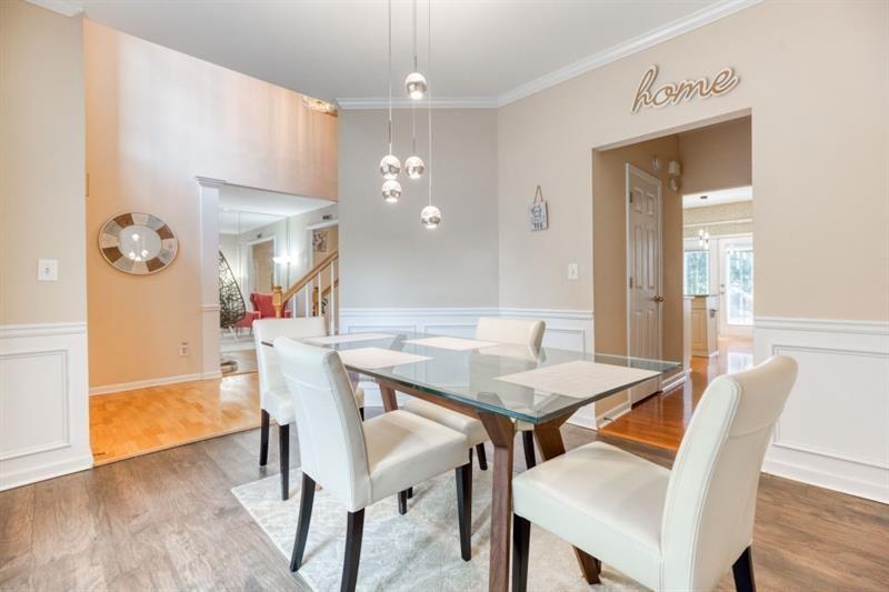 1008 Post Horn Run Lawrenceville, GA 30045 - Photo 6 of 64 a view of a dining room with furniture and wooden floor