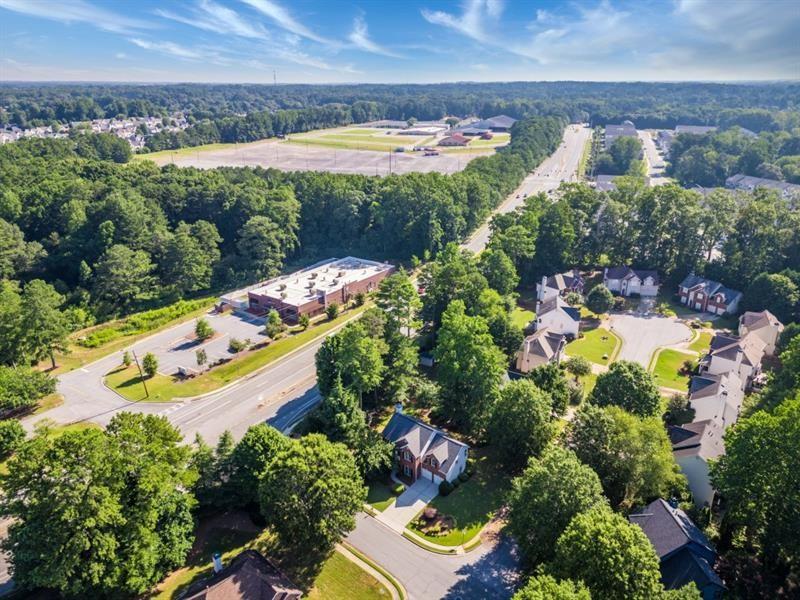 1008 Post Horn Run Lawrenceville, GA 30045 - Photo 63 of 64 an aerial view of a house with a yard and lake view in back