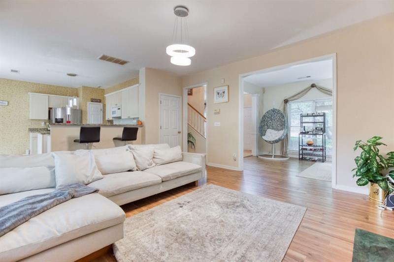 1008 Post Horn Run Lawrenceville, GA 30045 - Photo 8 of 64 a living room with furniture and a wooden floor