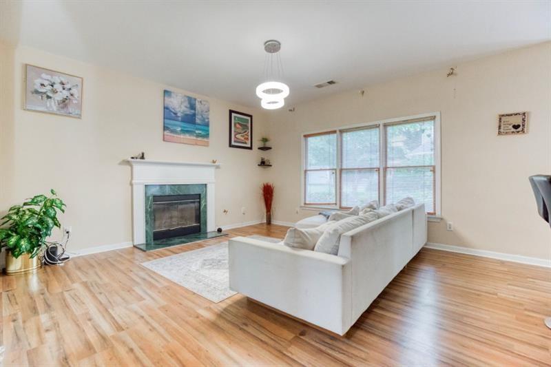 1008 Post Horn Run Lawrenceville, GA 30045 - Photo 9 of 64 a living room with furniture and a fireplace