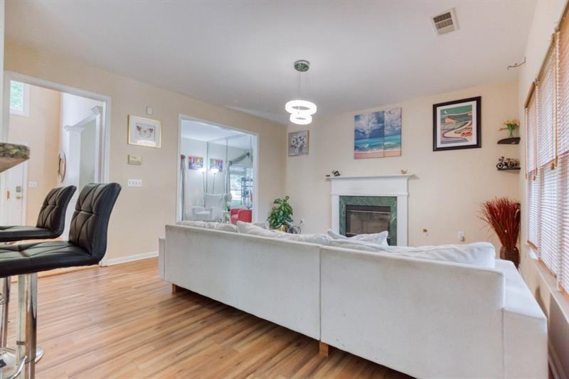 1008 Post Horn Run Lawrenceville, GA 30045 - Photo 10 of 64 a living room with furniture and a fireplace