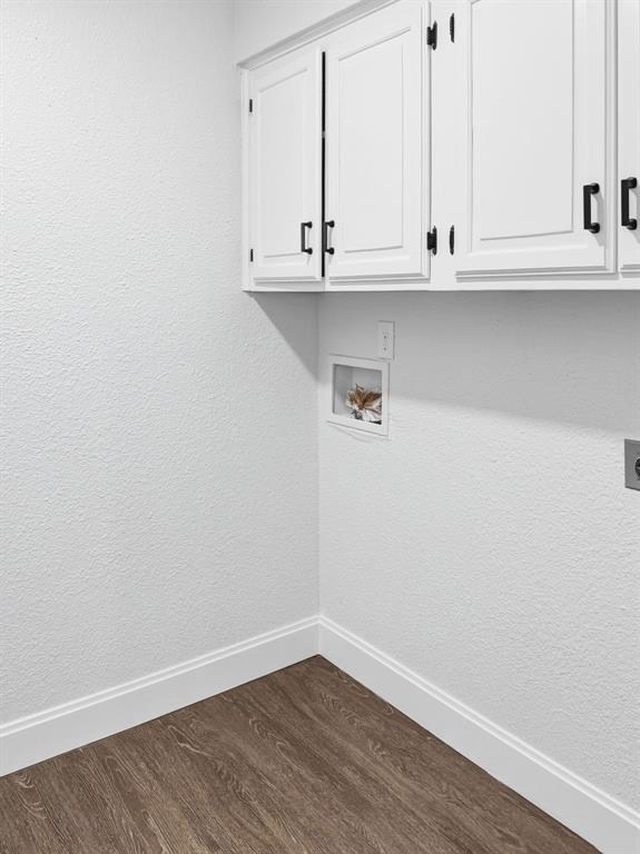 2409 Castle Street Irving, TX 75038 - Photo 11 of 32 a view of cabinets and wooden floor