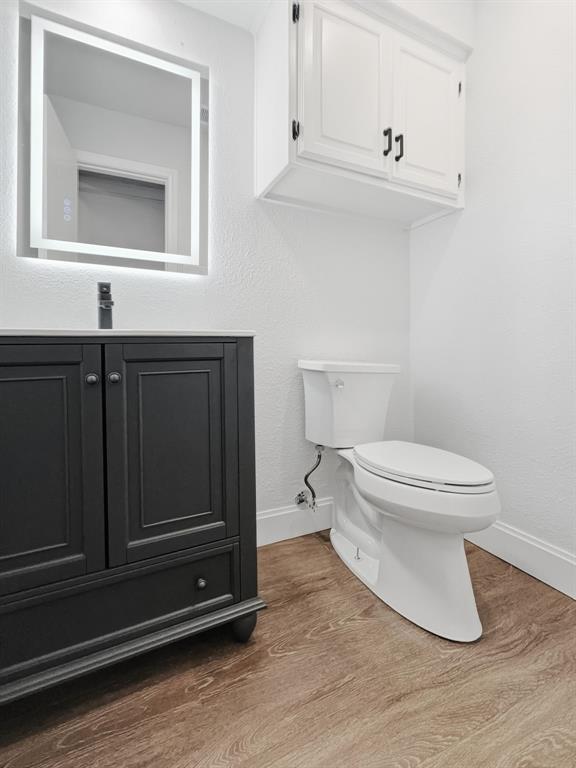 2409 Castle Street Irving, TX 75038 - Photo 12 of 32 a bathroom with a toilet