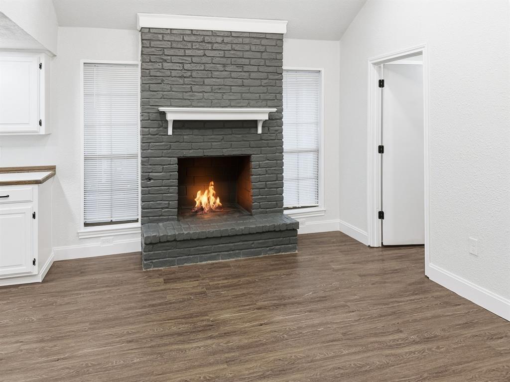 2409 Castle Street Irving, TX 75038 - Photo 14 of 32 a living room with a fireplace