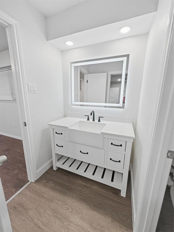 2409 Castle Street Irving, TX 75038 - Photo 20 of 32 a bathroom with a sink double vanity and a mirror