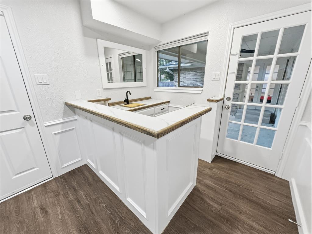 2409 Castle Street Irving, TX 75038 - Photo 25 of 32 a view of kitchen with sink and wooden floor