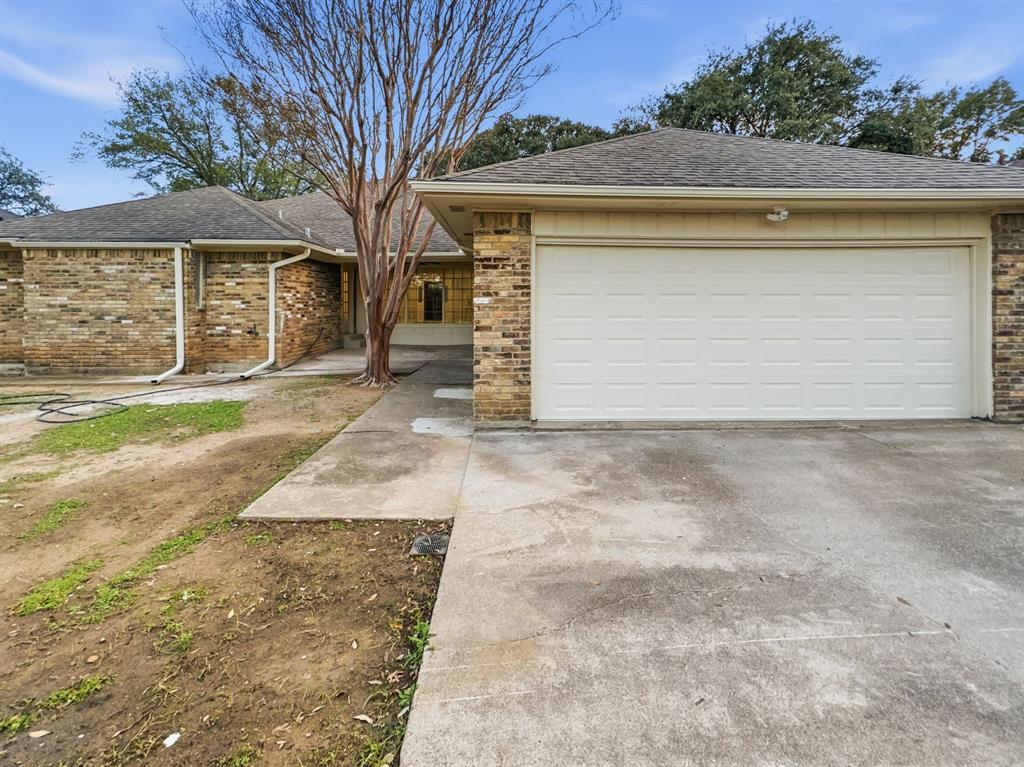 2409 Castle Street Irving, TX 75038 - Photo 32 of 32 a front view of a house with a yard and garage