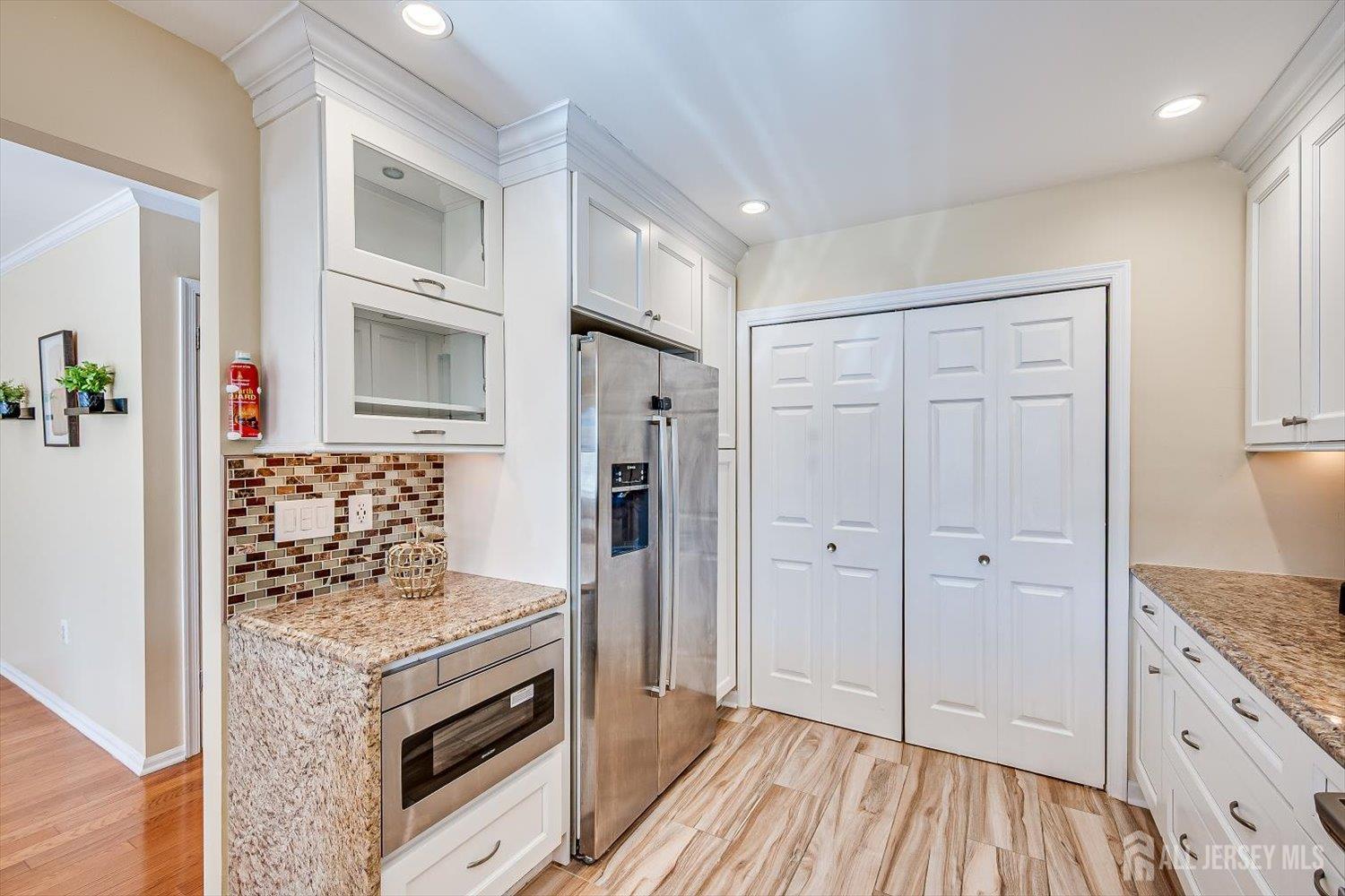 52 Springwood Court Princeton, NJ 08540 - Photo 12 of 34 a spacious bathroom with a granite countertop sink and a mirror