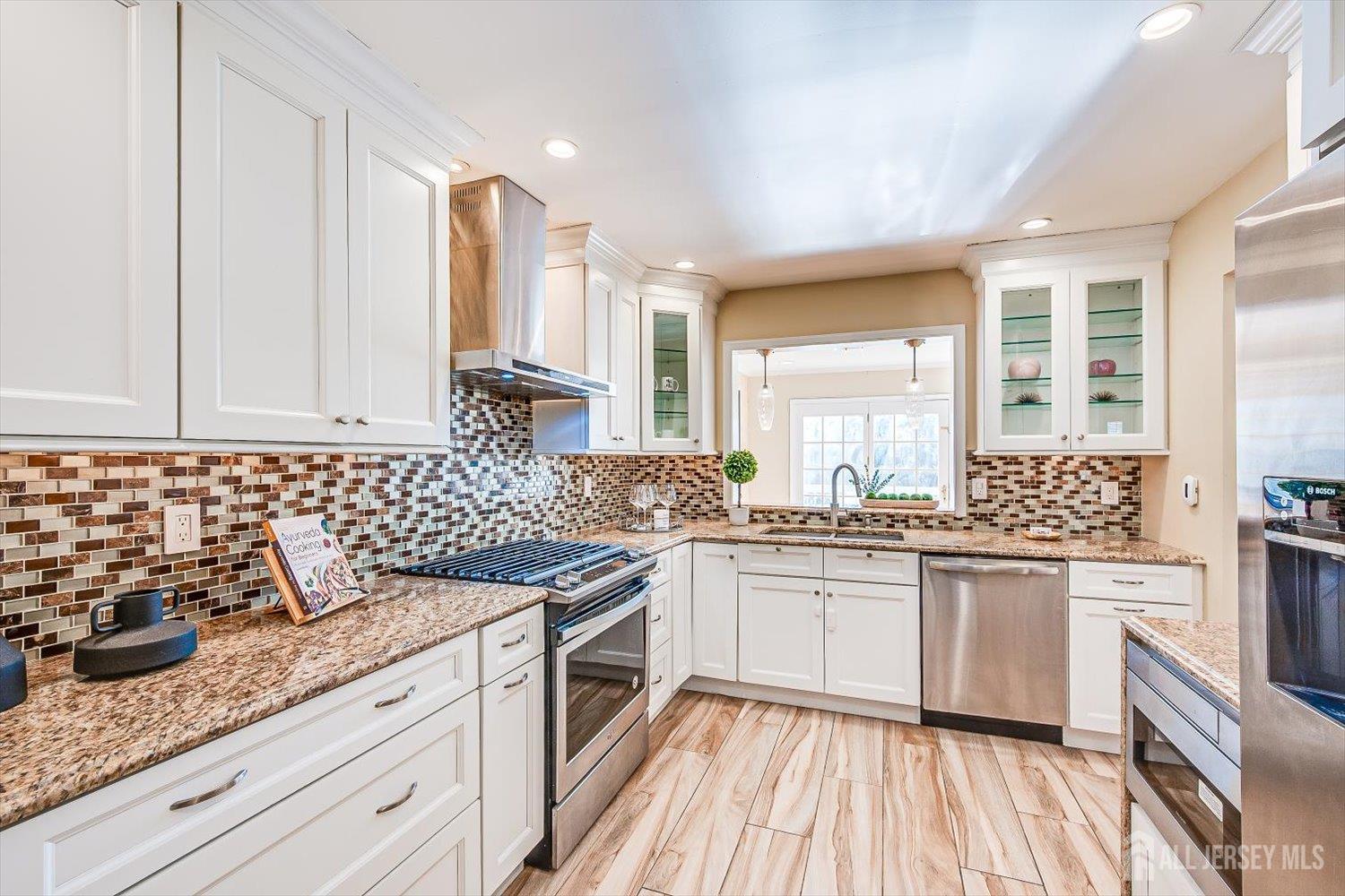 52 Springwood Court Princeton, NJ 08540 - Photo 13 of 34 a kitchen with a sink stove and cabinets