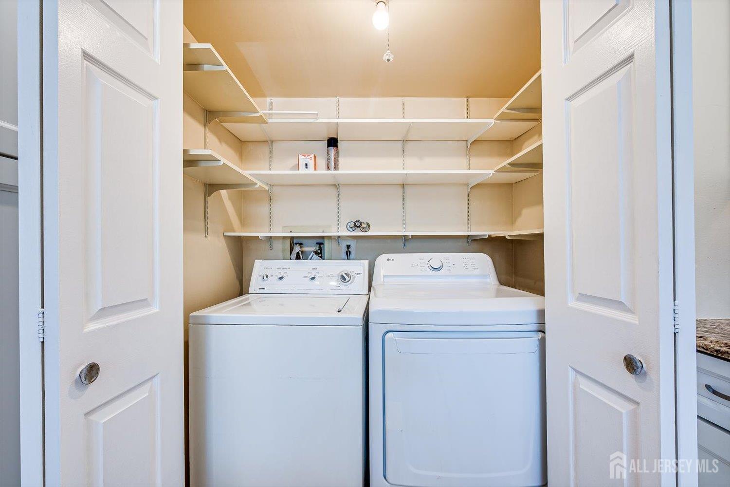 52 Springwood Court Princeton, NJ 08540 - Photo 14 of 34 a view of storage and utility room with washer and dryer