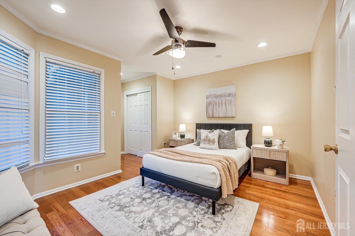 52 Springwood Court Princeton, NJ 08540 - Photo 15 of 34 a bedroom with a large bed and a chandelier