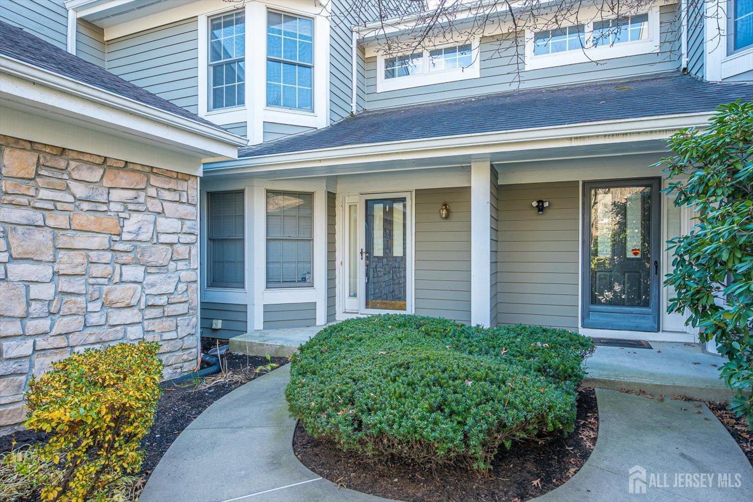 52 Springwood Court Princeton, NJ 08540 - Photo 2 of 34 front view of a brick house with a large window