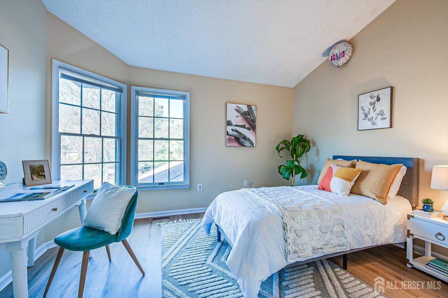 52 Springwood Court Princeton, NJ 08540 - Photo 26 of 34 a bedroom with a bed and wooden floor