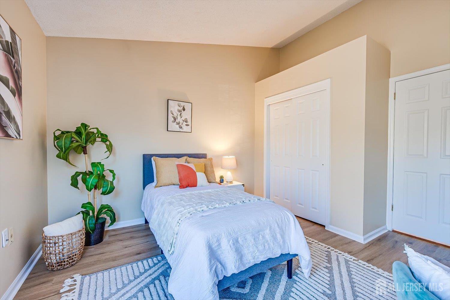 52 Springwood Court Princeton, NJ 08540 - Photo 27 of 34 a bed sitting in a bedroom next to a window
