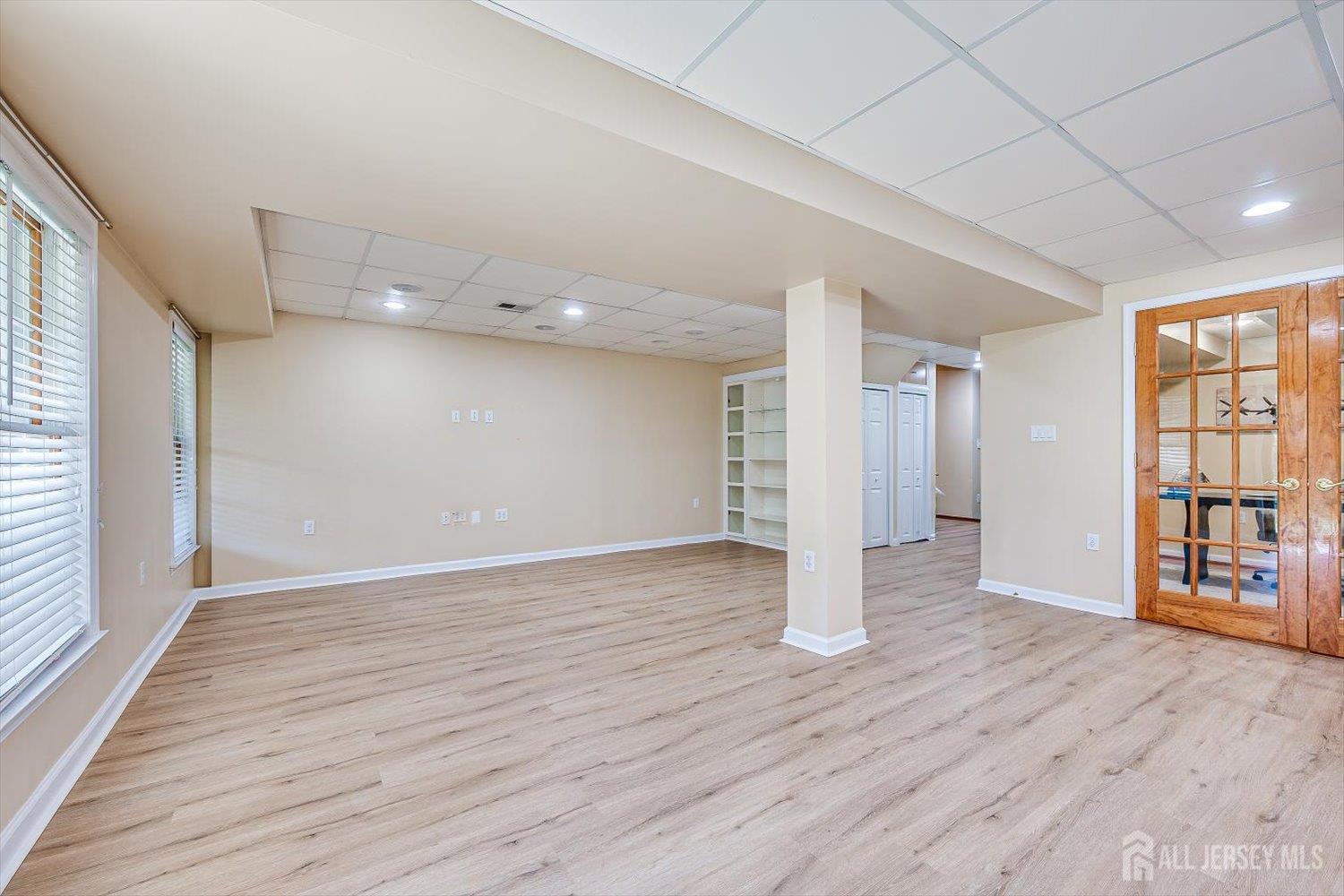 52 Springwood Court Princeton, NJ 08540 - Photo 29 of 34 wooden floor in an empty room with a window