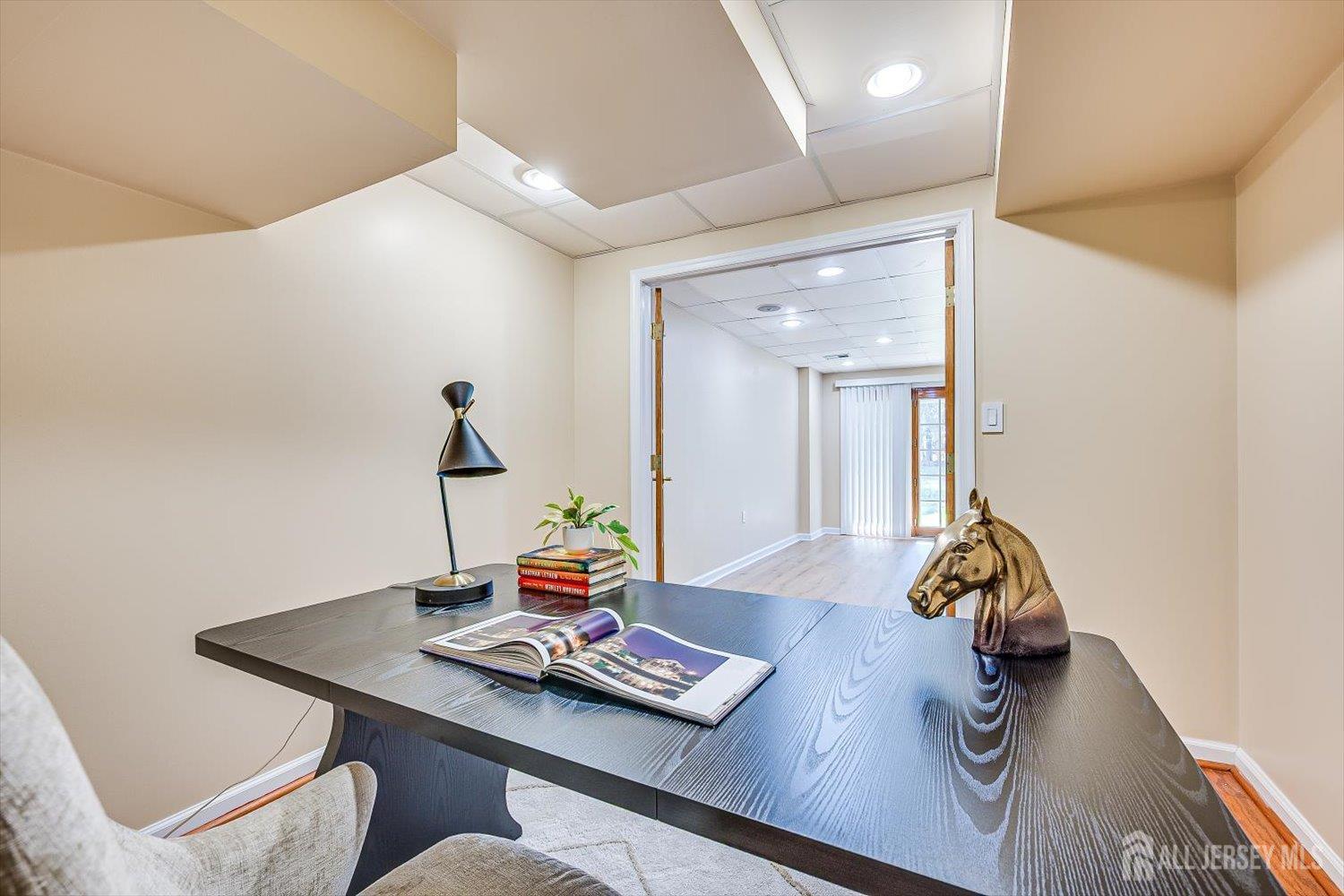 52 Springwood Court Princeton, NJ 08540 - Photo 31 of 34 a living room with table and wooden floor