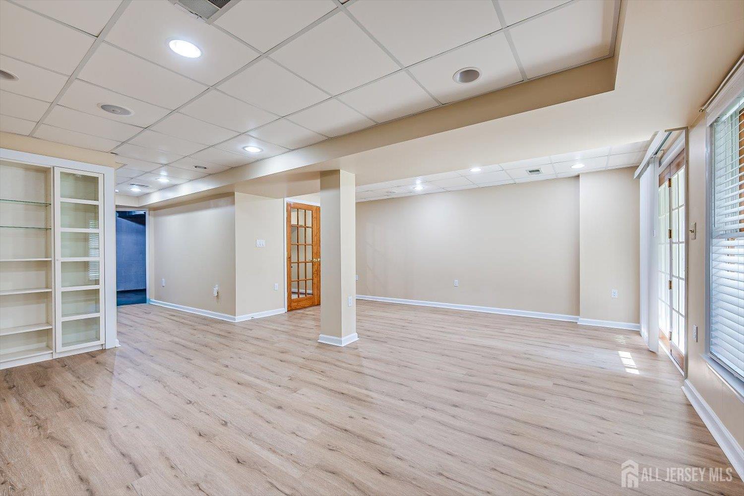 52 Springwood Court Princeton, NJ 08540 - Photo 33 of 34 a view of an empty room with wooden floor and closet area