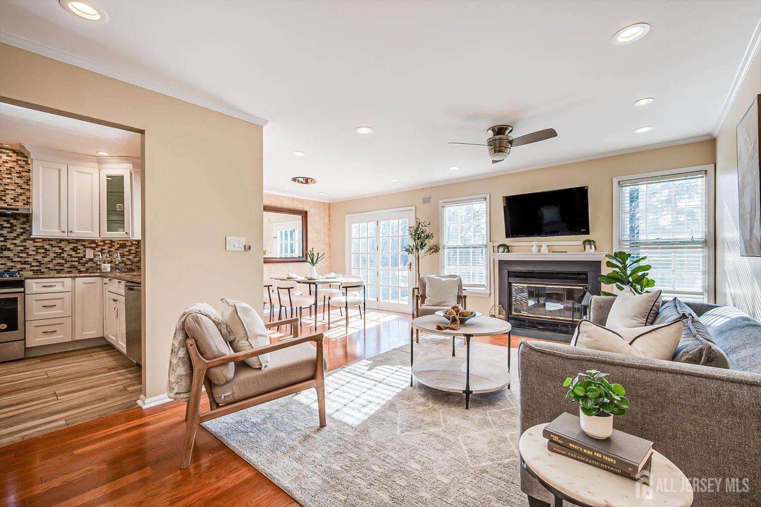 52 Springwood Court Princeton, NJ 08540 - Photo 6 of 34 a living room with furniture a fireplace and a flat screen tv