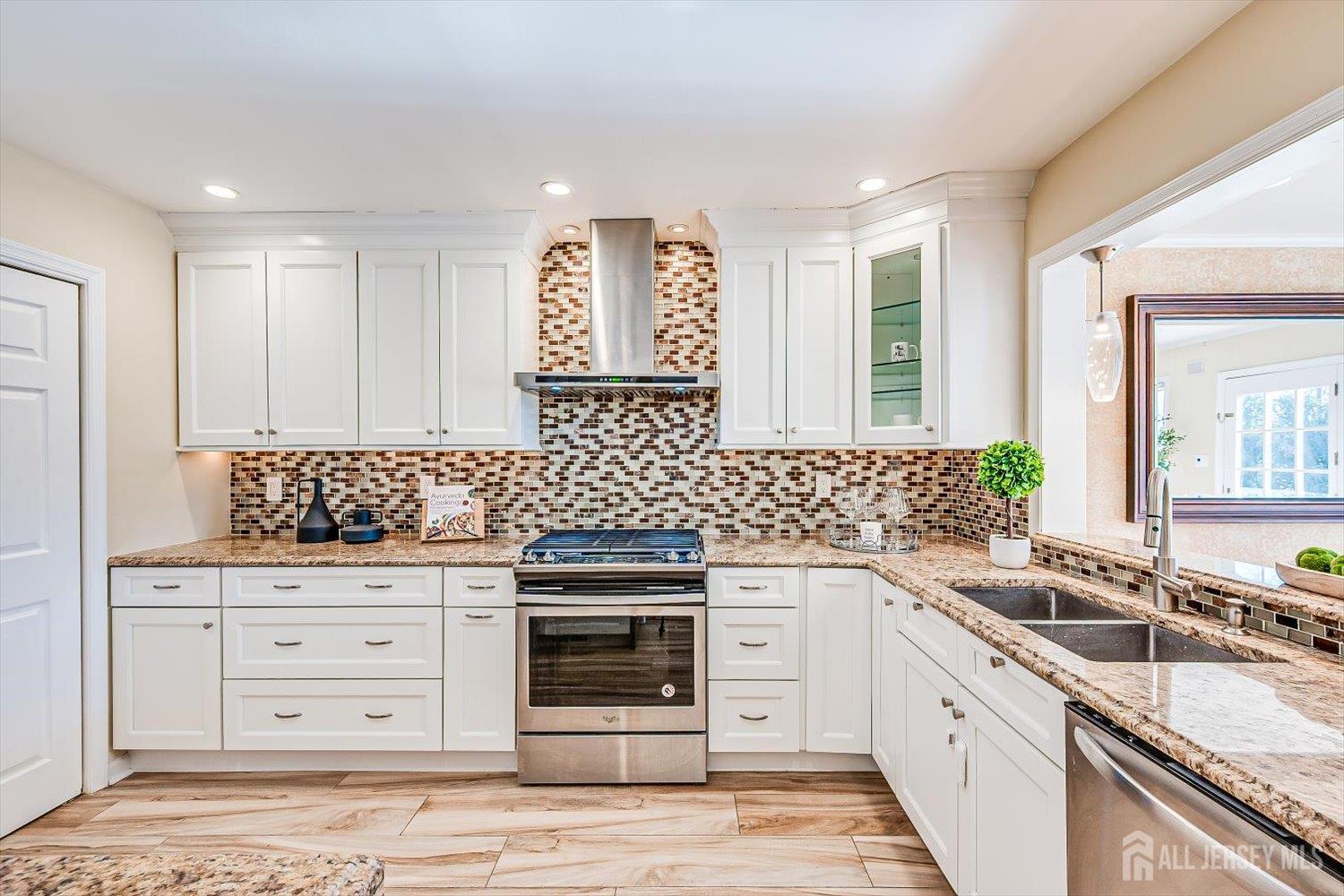 52 Springwood Court Princeton, NJ 08540 - Photo 10 of 34 a kitchen with granite countertop a sink and cabinets