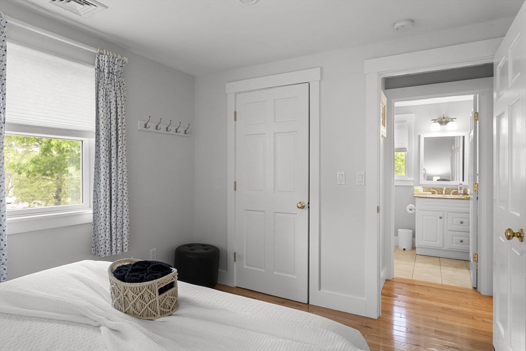 4 Hye Lane Edgartown, MA 02539 - Photo 34 of 41 a bedroom with a bed and wooden floor