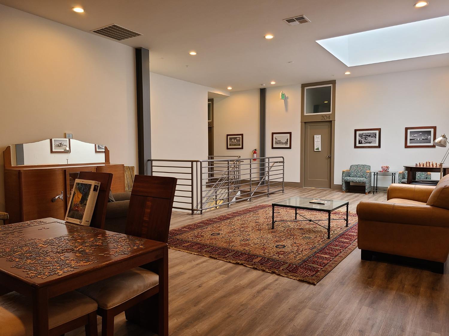 401 2nd Street, Unit 206 Woodland, CA 95695 - Photo 15 of 27 a living room with furniture rug and wooden floor
