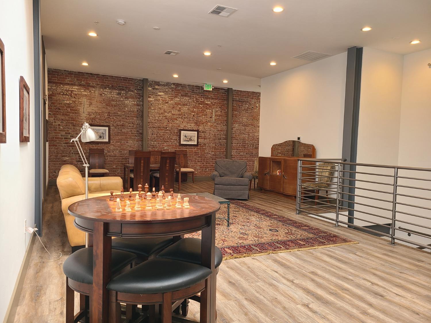 401 2nd Street, Unit 206 Woodland, CA 95695 - Photo 16 of 27 a large kitchen with a table and chairs