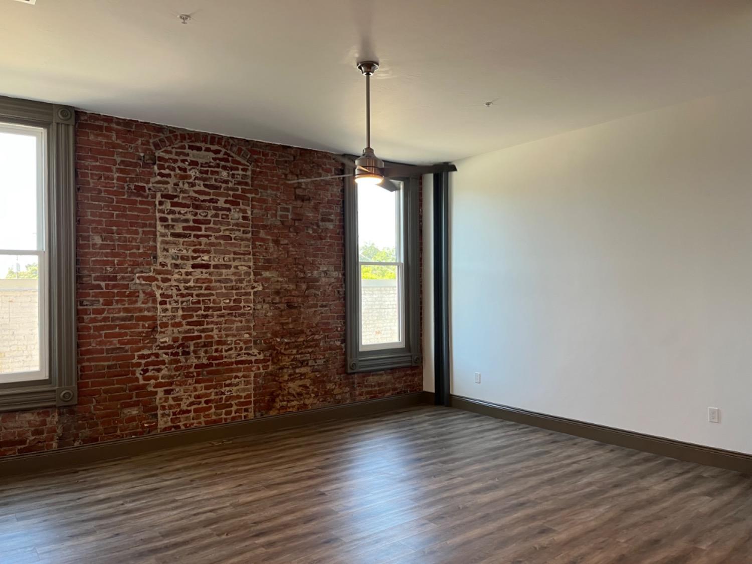 401 2nd Street, Unit 206 Woodland, CA 95695 - Photo 6 of 27 a view of empty room with wooden floor and fan