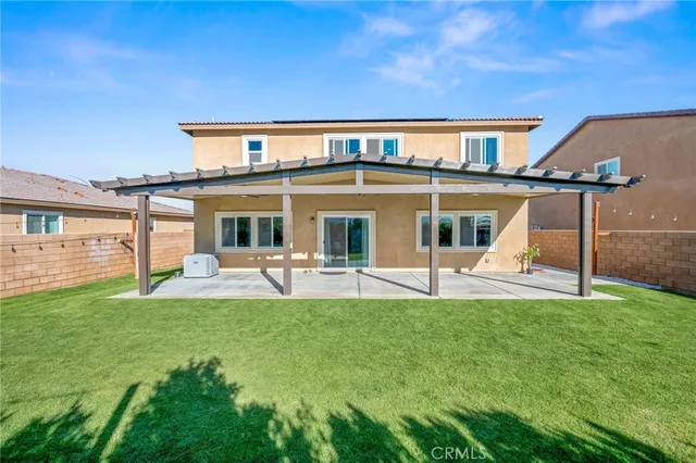 an aerial view of a house with a big yard and large trees