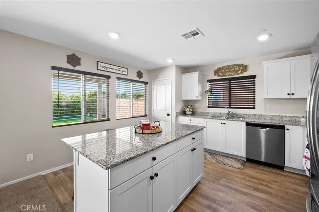 a kitchen that has a sink and a stove