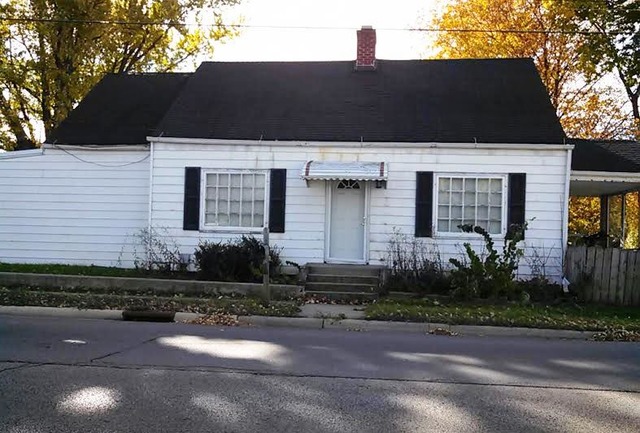 4305 Newburg Road Rockford, IL 61108 - Photo 1 of 11 a front view of a house with garden
