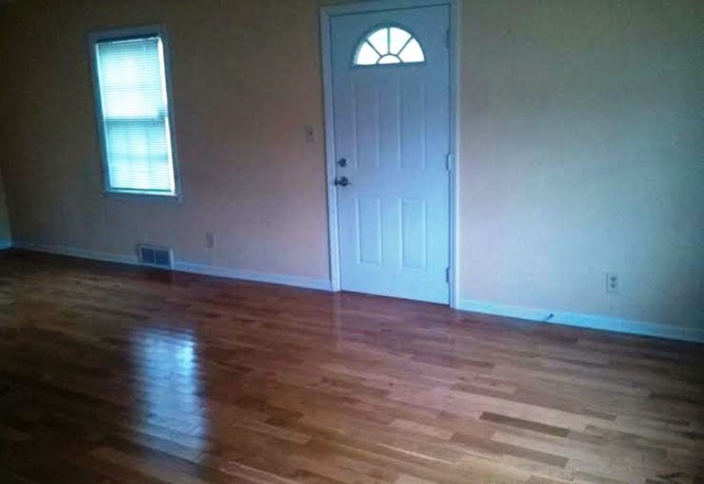 4305 Newburg Road Rockford, IL 61108 - Photo 2 of 11 an empty room with wooden floor closet and windows