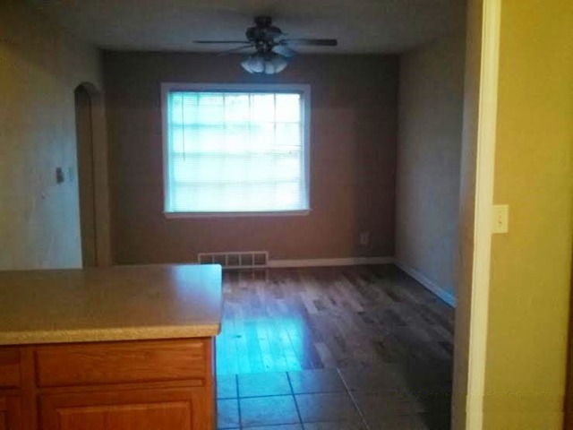 4305 Newburg Road Rockford, IL 61108 - Photo 6 of 11 an empty room with wooden floor and windows