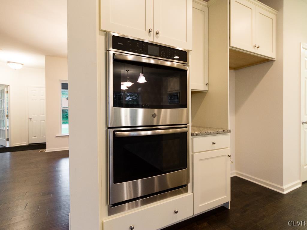 6559 Gun Club Road, Unit 35 Coopersburg, PA 18036 - Photo 15 of 48 a stove top oven sitting inside of a kitchen