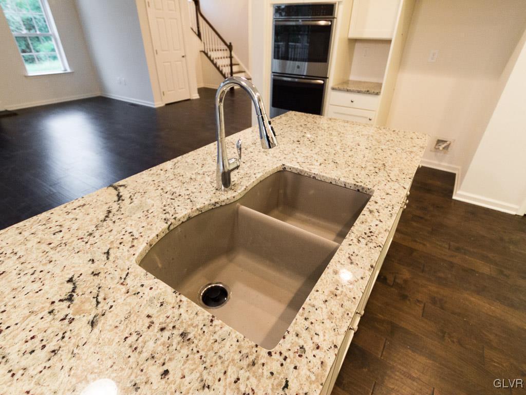 6559 Gun Club Road, Unit 35 Coopersburg, PA 18036 - Photo 16 of 48 a kitchen with a sink and a stove