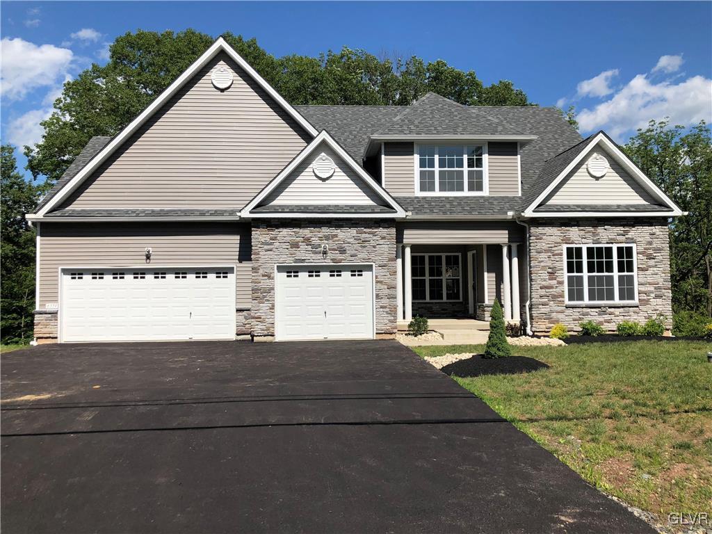 6559 Gun Club Road, Unit 35 Coopersburg, PA 18036 - Photo 2 of 48 front view of a house with a yard