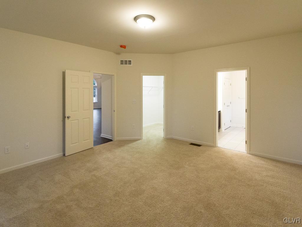 6559 Gun Club Road, Unit 35 Coopersburg, PA 18036 - Photo 27 of 48 an empty room with windows