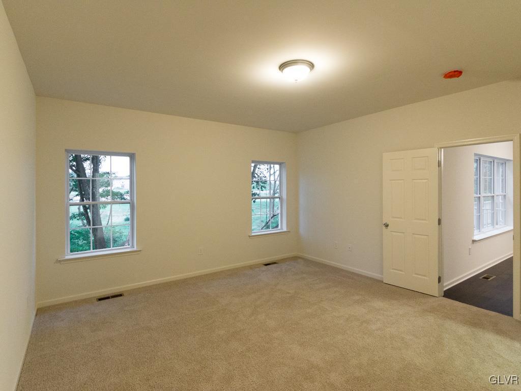 6559 Gun Club Road, Unit 35 Coopersburg, PA 18036 - Photo 28 of 48 a view of an empty room with a window