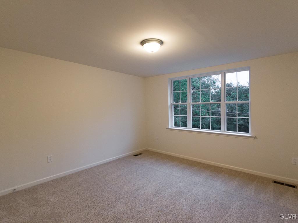6559 Gun Club Road, Unit 35 Coopersburg, PA 18036 - Photo 37 of 48 an empty room with a window