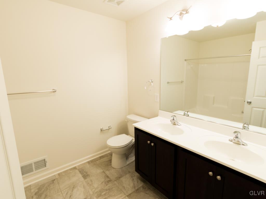 6559 Gun Club Road, Unit 35 Coopersburg, PA 18036 - Photo 39 of 48 a bathroom with a sink and a mirror