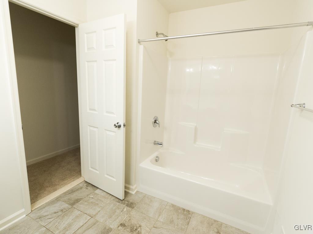 6559 Gun Club Road, Unit 35 Coopersburg, PA 18036 - Photo 40 of 48 a bathroom with a bathtub and a shower